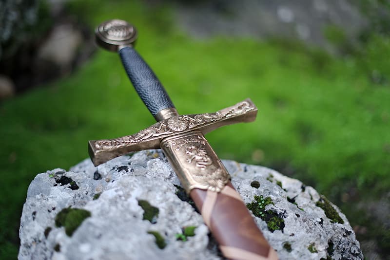 Excalibur, King Arthur's sword, with brown braided scabbard