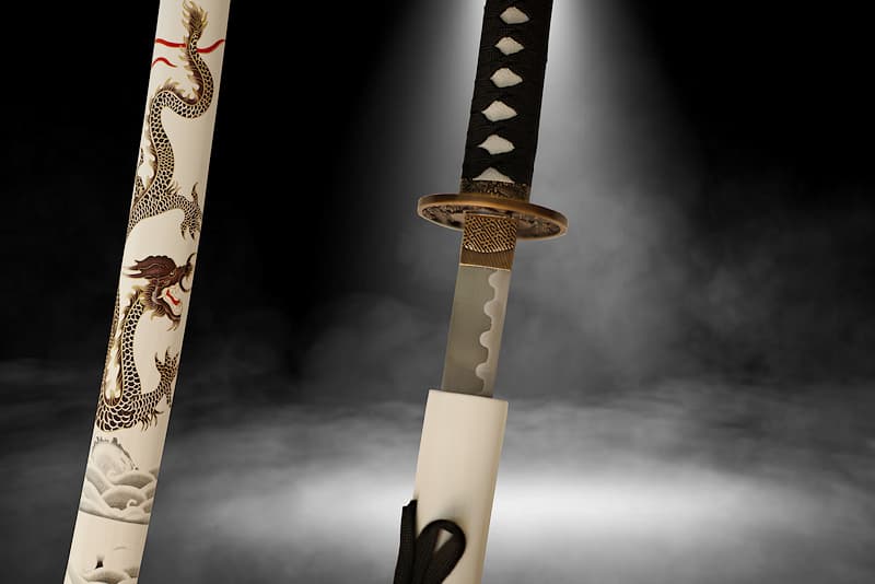 Collection Katana Tsuka-Ito (柄糸) and Sageo (下緒) black, Saya (鞘 scabbard) white with silkscreen dragon between sky and sea | Legend has it that I am mysterious, visible only to the chosen few I choose. White in the light, black at night, I disappear like the dragon adorning my scabbard (鞘 Saya), between sea waves and the highest clouds.