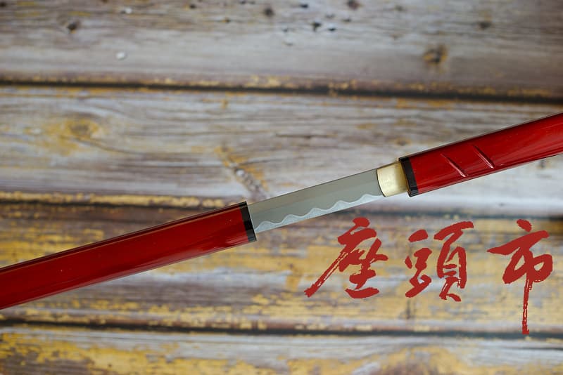 Shikomitsue (仕込み杖 training rod); sharpened straight blade, 1045 steel, mounted as a sword rod, replica of the film and TV series; delivered in a wooden case and protective cover | Straight and finely sharpened, my blade is mounted discreetly, like a sword rod. My red outfit is reminiscent of the blood I drink. My master swordsman's Yakuza (ヤクザ) past is a regular reminder. Yet he has long since made the choice to protect the innocent.