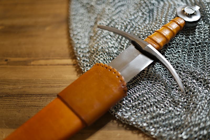 European forged sword, XVᵗʰ / XVIᵗʰ century, steel hilt and pommel, brown / ochre wood and leather handle and scabbard.