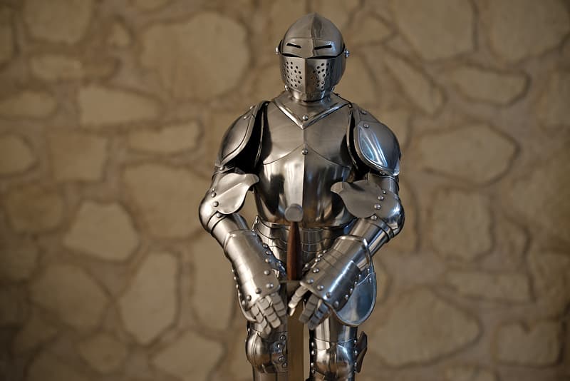 Reproduction (miniature, 1/3 scale) of a French medieval suit of armor, with sword and stand (delivered mounted).