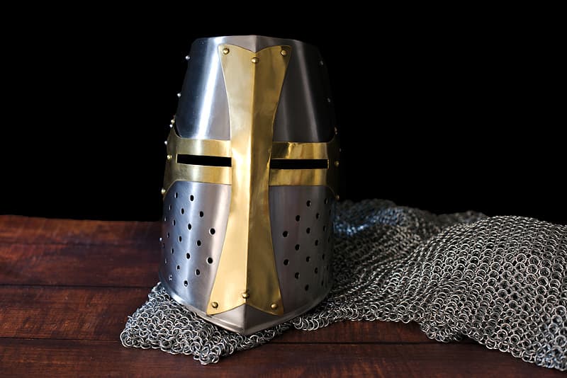 Steel Templar helmet with brass cross | Some people think I'm a pure invention, but my twin is on display in the Berlin Museum. Characteristic of crusaders' military equipment in the late Middle Ages, I protect the knight's head in the same way that a tank claims to protect its occupants today.