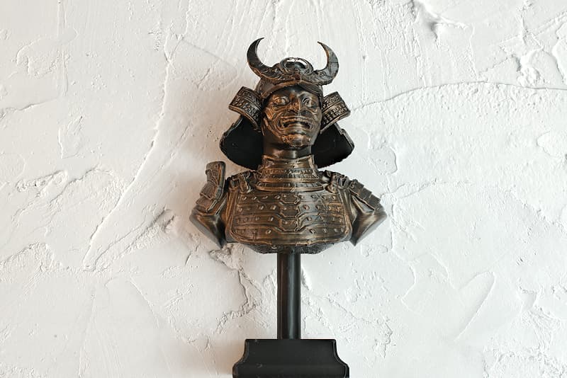 3D-printed collectible statuette, aged bronze look | In my lifetime, I wouldn't have imagined that my bust would be used as a model. My characteristic armor (鎧 Yoroï), is thus reproduced with many details, along with my Kabuto (兜 samurai helmet), my Mempō (面頬 samurai mask)