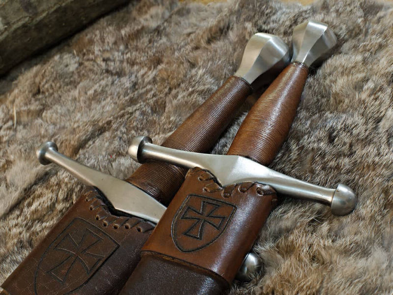 Medieval German sword and dagger on natural skin