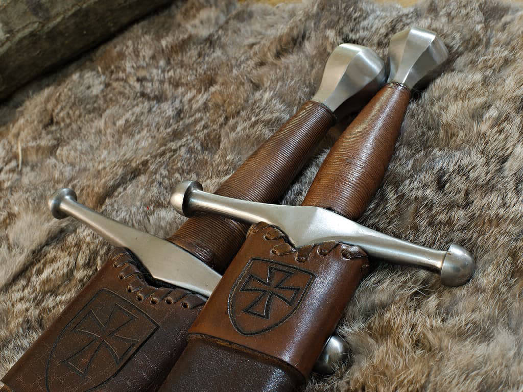 Medieval German sword and dagger on natural skin