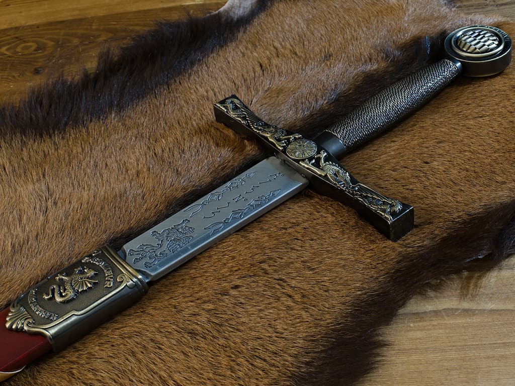 Staging Excalibur, the legendary sword of Arthur, King of Brittany Excalibur, King Arthur's sword, with red braided scabbard #Terressens