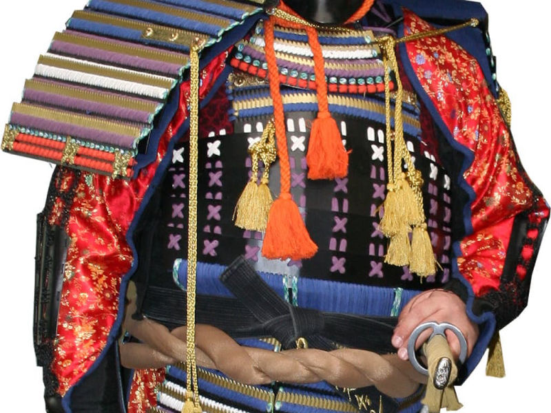 Red samurai amure worn by a martial artist, with a katana Red samurai amure worn by a martial artist, with a katana