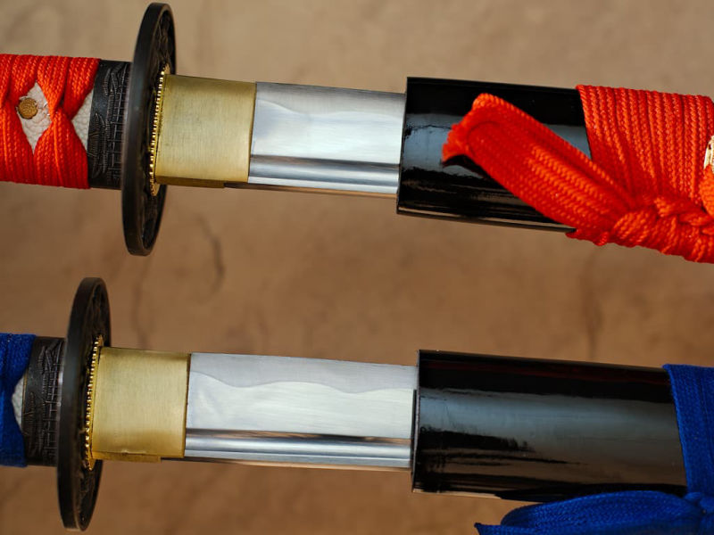 Mù-jīn, sharpened wakizashi wood (mù, 木) metal (jīn, 金): detail of the blade emerging from its scabbard (saya), resting on natural bamboo Bushidō, sharp katanas (武士道 the way of the warrior) #Terressens