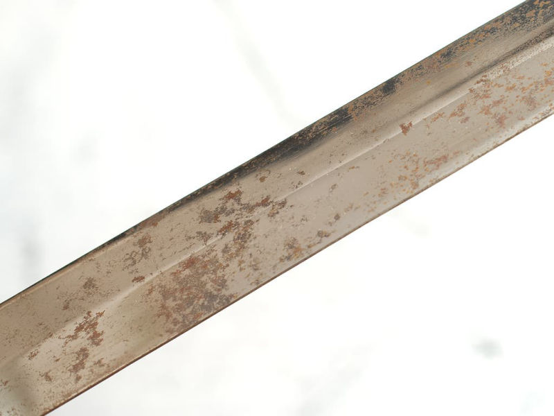 The blade of the sword left in the open has oxidized.