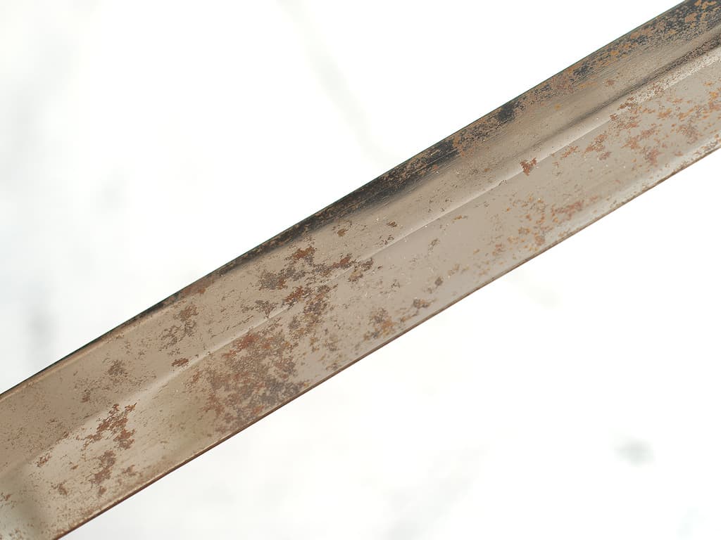 The blade of the sword left in the open has oxidized.