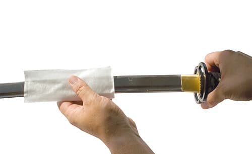 Figure 1: Cleaning the blade with a microfiber cloth