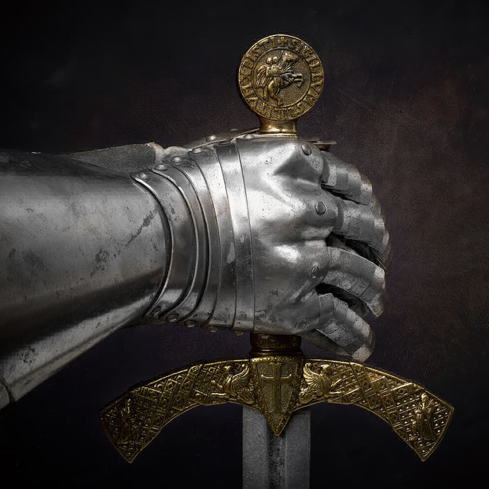 Templar sword decorated with the Templar seal, with pair of medieval gauntlets