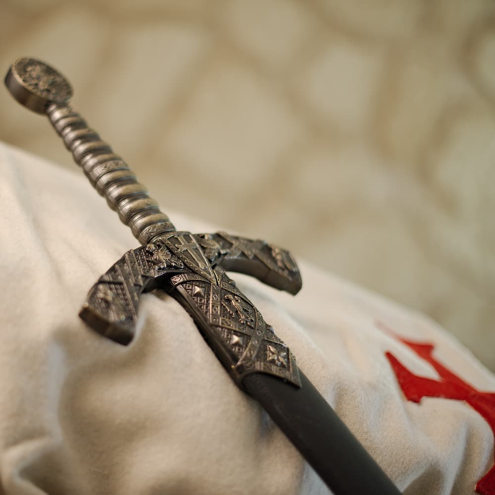 Decorative Templar sword with Templar seal (pommel), knights, griffins, shield and Templar cross; black scabbard