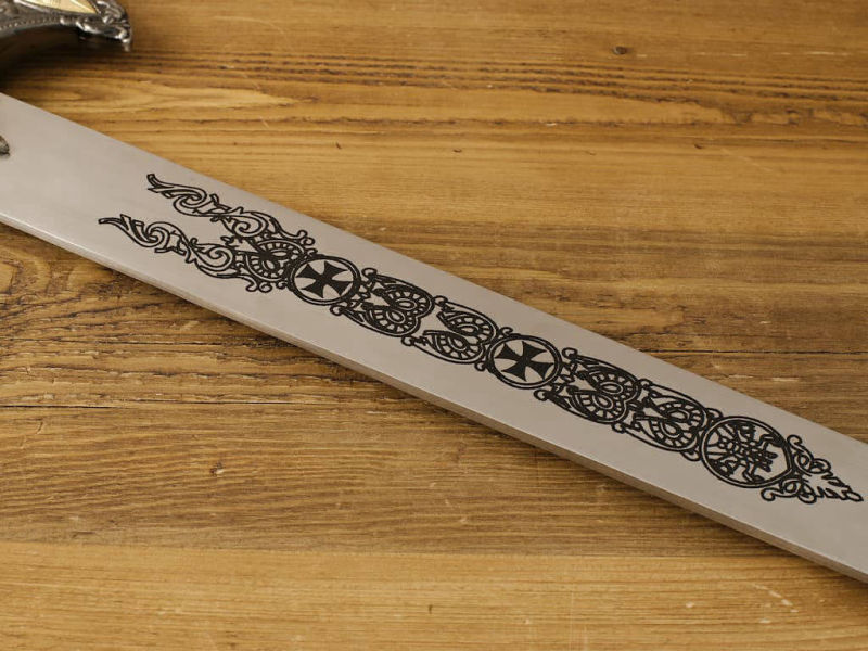 Detail of the decoration on the blade of the "Knight of Christ" Templar sword.