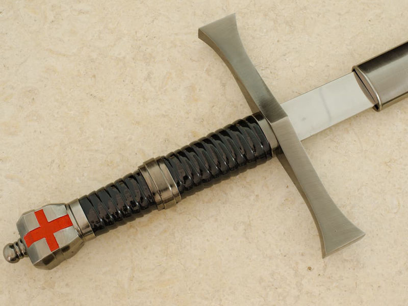 A hand protected by a medieval gauntlet takes possession of the decorative Templar sword. Templar sword "Return from the Holy Land" #Terressens
